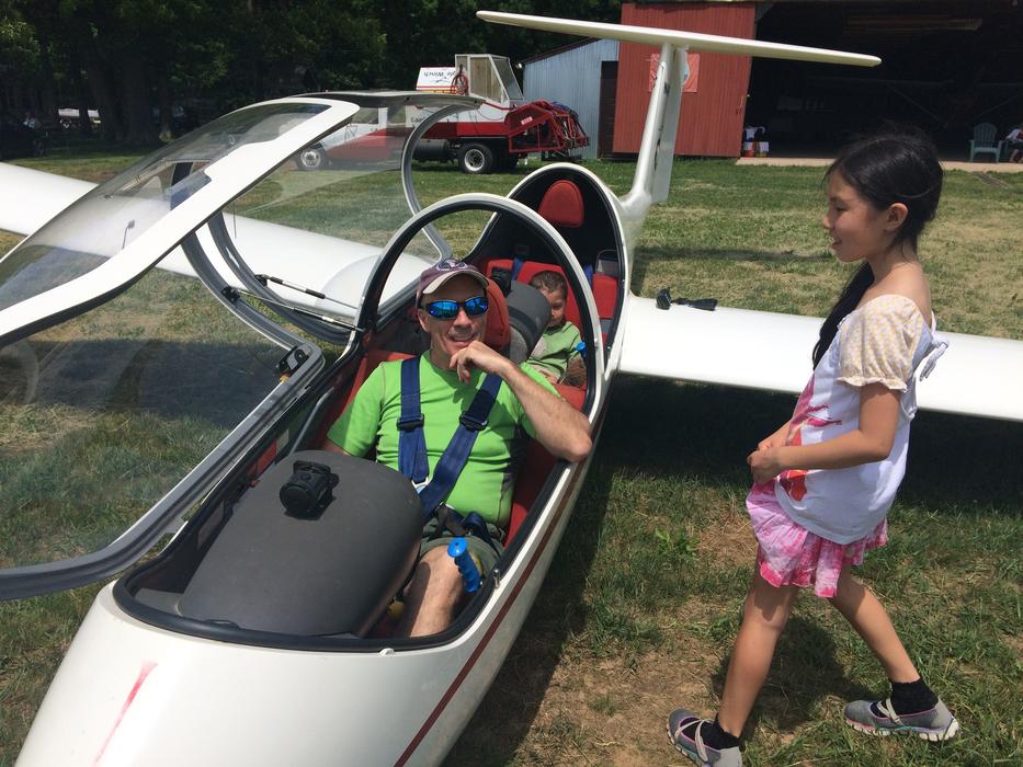 Dad and kids in glider